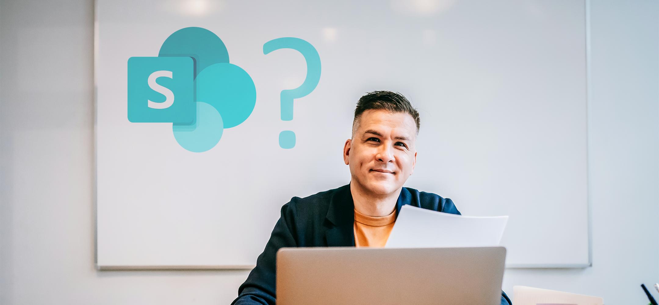 man sitting in front of white board with Microsoft SharePoint logo and question mark